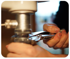 A person fixes the drain in their home